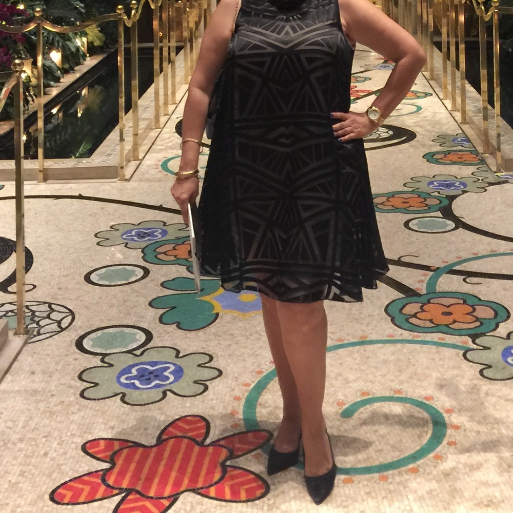 Black cocktail dress with peekaboo slits